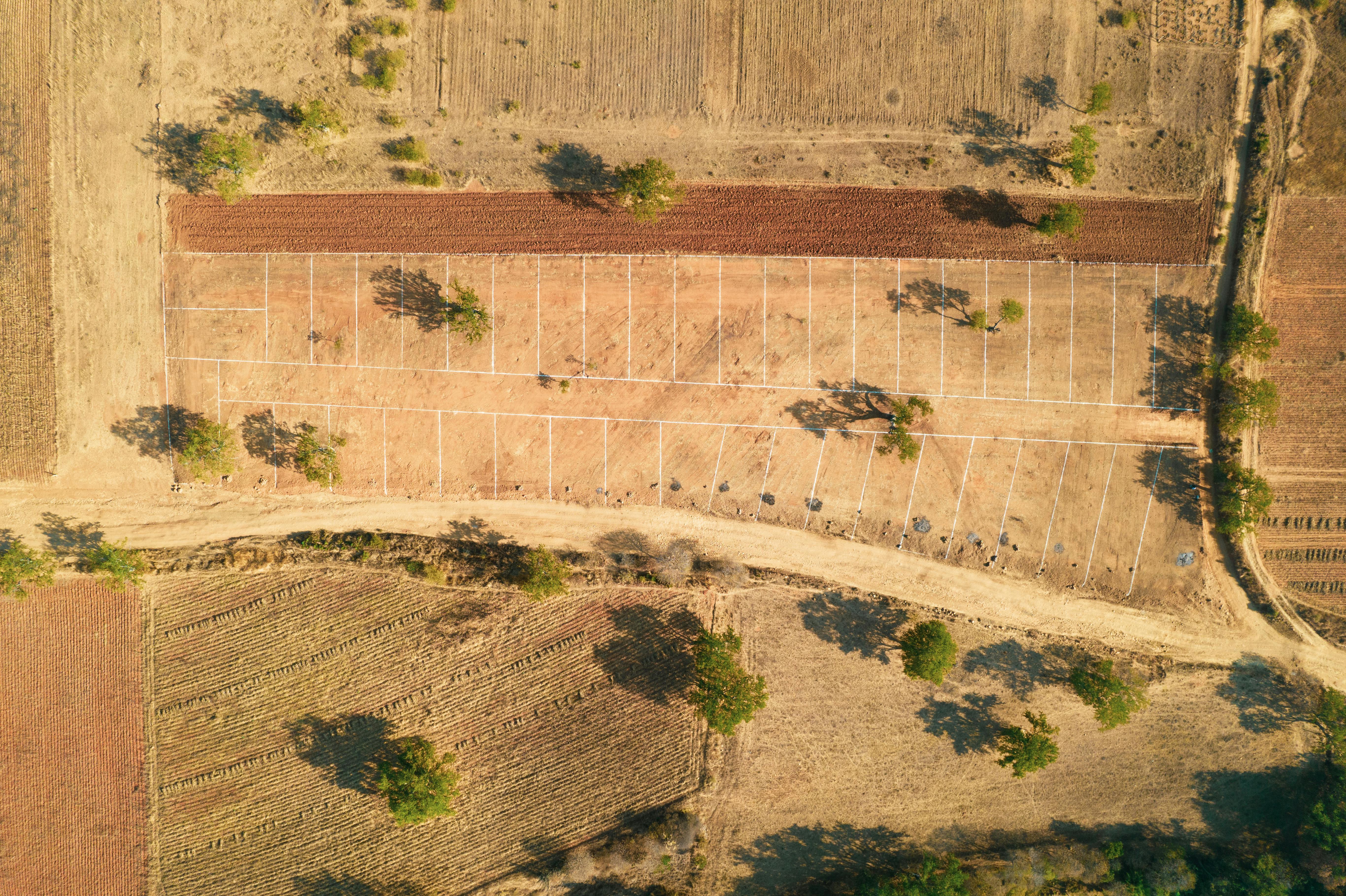 Aerial view of vacant land parcels with plot boundary lines